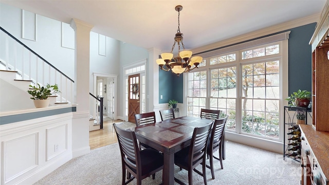 6108 Mcilwaine Rd, Huntersville, NC 28078 - dining space featuring a chandelier, stairs, and light carpet