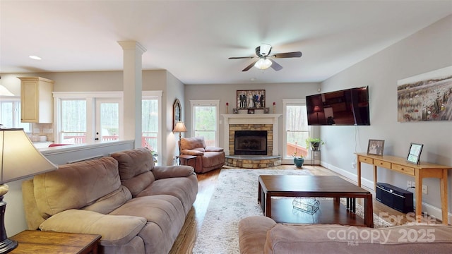 6108 Mcilwaine Rd, Huntersville, NC 28078 - living area with a fireplace, light wood-style floors, baseboards, and ceiling fan