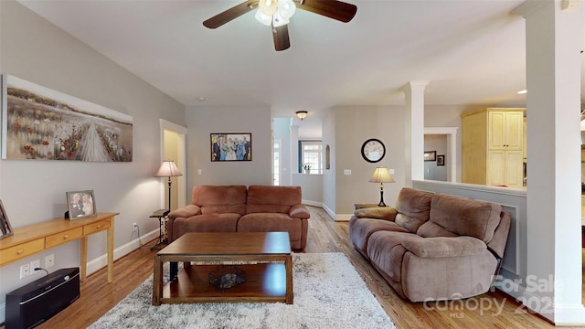 6108 Mcilwaine Rd, Huntersville, NC 28078 - living area with light wood-style flooring, a ceiling fan, and baseboards