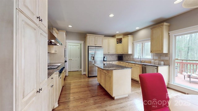 6108 Mcilwaine Rd, Huntersville, NC 28078 - kitchen featuring wall chimney exhaust hood, stainless steel appliances, a center island, light wood finished floors, and a sink