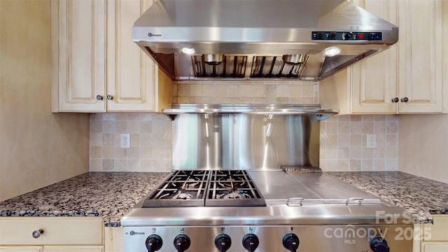 6108 Mcilwaine Rd, Huntersville, NC 28078 - kitchen featuring under cabinet range hood, light stone counters, backsplash, and stove