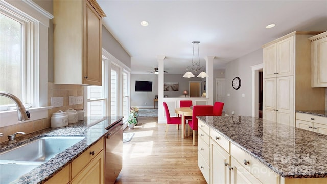 6108 Mcilwaine Rd, Huntersville, NC 28078 - kitchen featuring light wood-type flooring, stainless steel dishwasher, a sink, and a healthy amount of sunlight