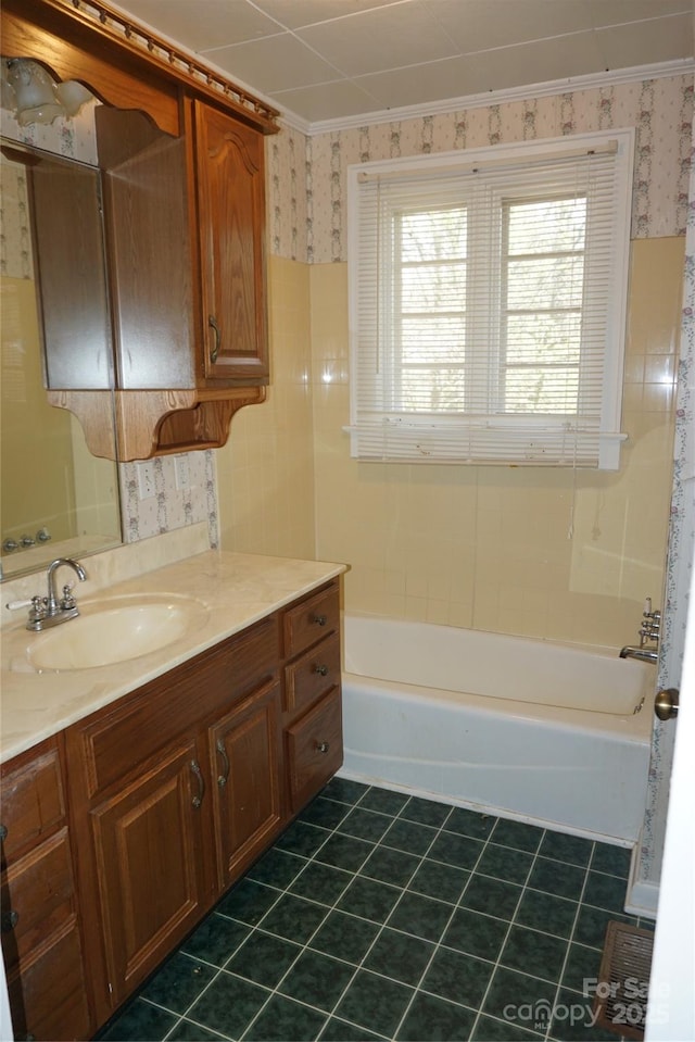 bathroom with tile patterned flooring, wallpapered walls, and vanity