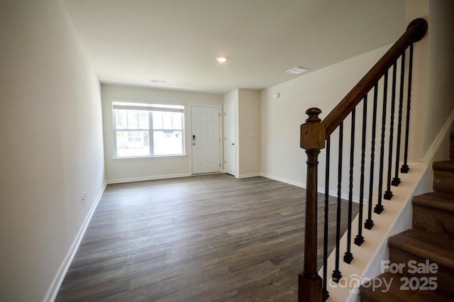entryway with baseboards, stairs, dark wood-style floors, and recessed lighting