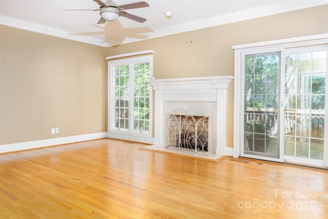 19113 Southport Dr, Cornelius, NC 28031 - unfurnished living room with ceiling fan, baseboards, ornamental molding, and wood finished floors