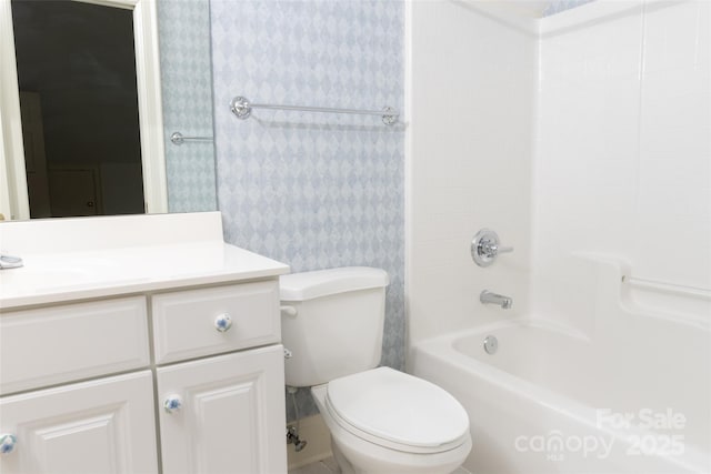 19113 Southport Dr, Cornelius, NC 28031 - bathroom featuring shower / bathing tub combination, wallpapered walls, toilet, and vanity