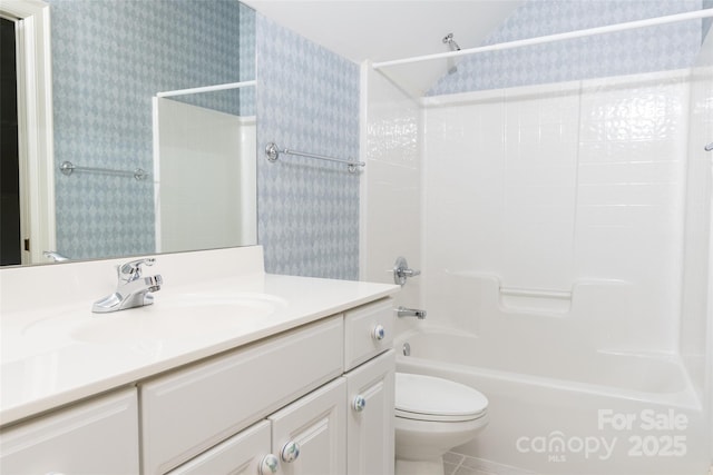 19113 Southport Dr, Cornelius, NC 28031 - bathroom featuring wallpapered walls, vanity,  shower combination, and toilet