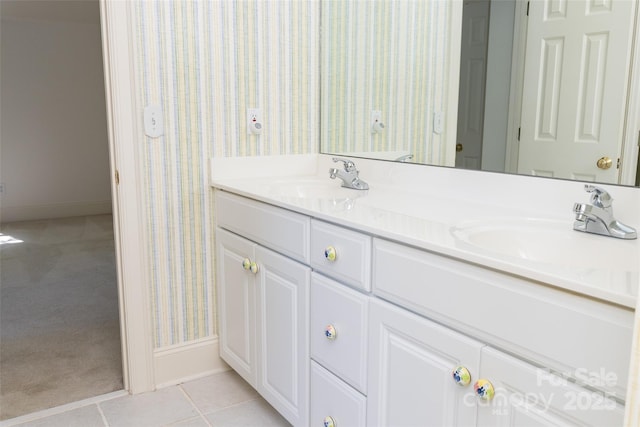 19113 Southport Dr, Cornelius, NC 28031 - bathroom featuring wallpapered walls, double vanity, a sink, and baseboards