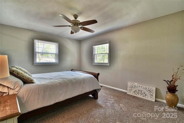carpeted bedroom with baseboards and a ceiling fan