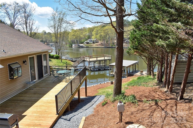 dock area featuring a deck with water view