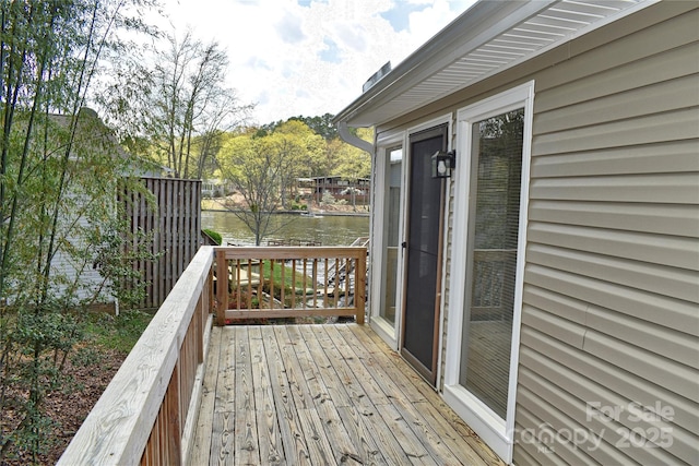 wooden deck with a water view