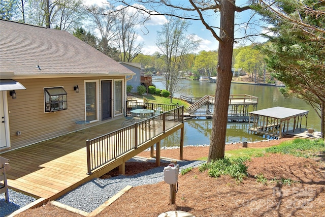 dock area featuring a deck with water view