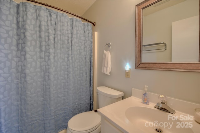 bathroom with a textured ceiling, toilet, a shower with shower curtain, and vanity