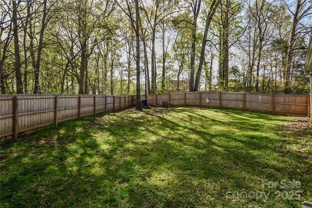 view of yard featuring a fenced backyard
