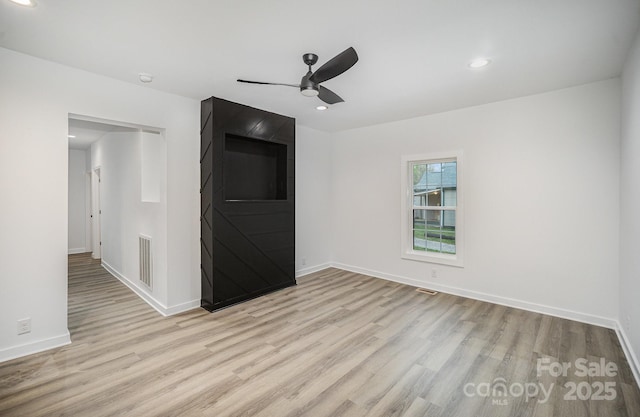 308 Birch St, Lowell, NC 28098 - spare room featuring light wood finished floors, a ceiling fan, baseboards, recessed lighting, and a smoke detector