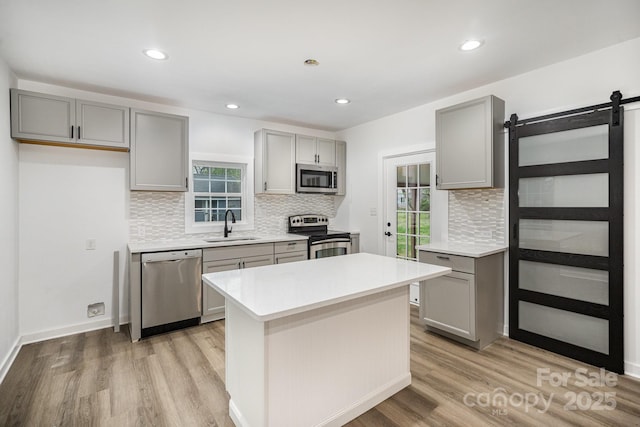 308 Birch St, Lowell, NC 28098 - kitchen with appliances with stainless steel finishes, gray cabinetry, a sink, and recessed lighting