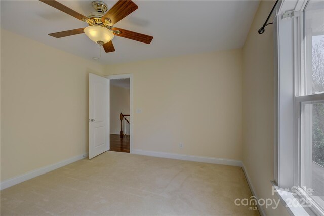 14103 Grand Traverse Dr, Charlotte, NC 28278 - unfurnished bedroom featuring carpet, baseboards, and ceiling fan