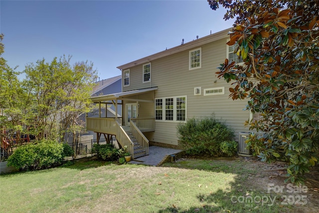14103 Grand Traverse Dr, Charlotte, NC 28278 - rear view of property with a yard, fence, and stairway