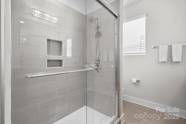 324 Uptown W Dr, Charlotte, NC 28208 - full bath featuring a shower stall, baseboards, and tile patterned flooring