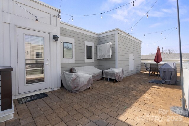 324 Uptown W Dr, Charlotte, NC 28208 - view of patio featuring grilling area and outdoor dining area