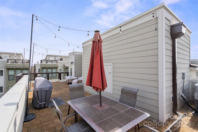 324 Uptown W Dr, Charlotte, NC 28208 - view of patio featuring a grill and outdoor dining area