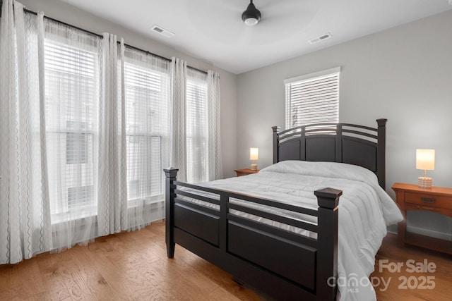 324 Uptown W Dr, Charlotte, NC 28208 - bedroom featuring visible vents and light wood finished floors