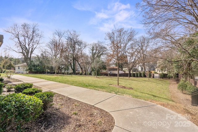 324 Uptown W Dr, Charlotte, NC 28208 - view of home's community featuring a lawn and fence
