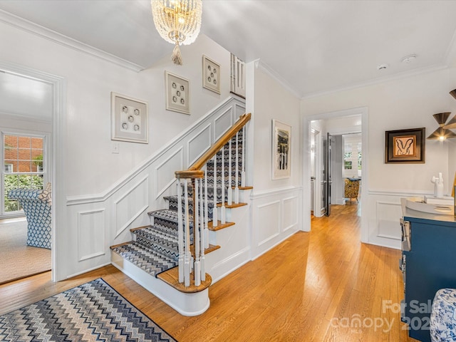 staircase with a decorative wall and plenty of natural light