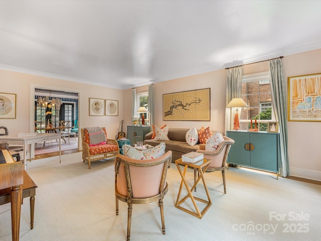 carpeted living room featuring ornamental molding, baseboards, and a wealth of natural light