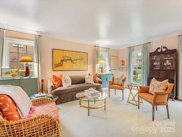 living area with crown molding and light carpet