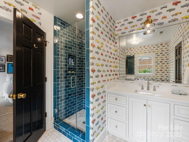 full bath featuring visible vents, wallpapered walls, a stall shower, and vanity