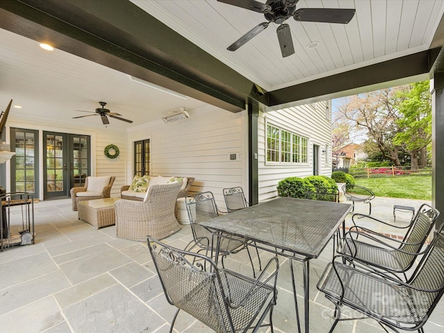 view of patio / terrace featuring outdoor dining area, french doors, ceiling fan, and fence