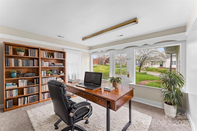 home office with visible vents and baseboards