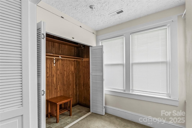 closet featuring visible vents