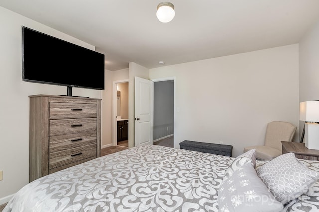 bedroom with carpet flooring and baseboards