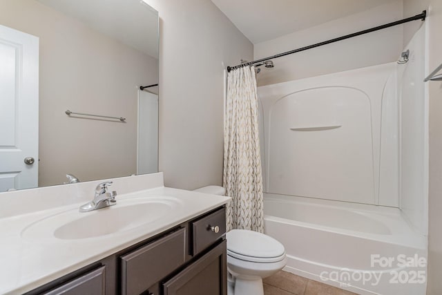 full bathroom with tile patterned flooring, shower / tub combo, vanity, and toilet