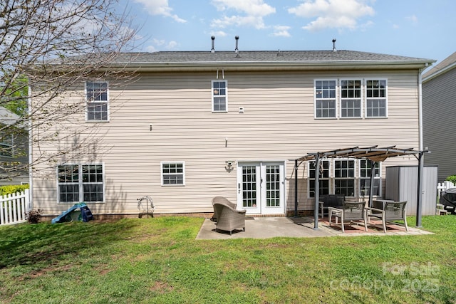 rear view of house featuring a yard, fence, a patio, and a pergola