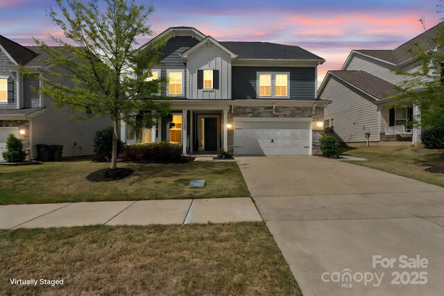 15126 Shallow Ridge Rd, Charlotte, NC 28278 - traditional home with board and batten siding, a garage, stone siding, a front lawn, and driveway