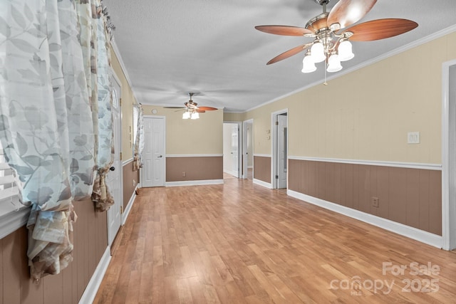 394 Efird St, Gastonia, NC 28054 - unfurnished room with a ceiling fan, a textured ceiling, light wood-style floors, and crown molding
