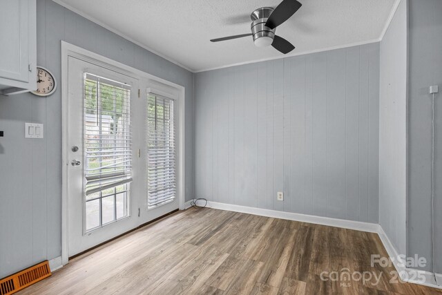 394 Efird St, Gastonia, NC 28054 - interior space with light wood finished floors, a ceiling fan, visible vents, and ornamental molding