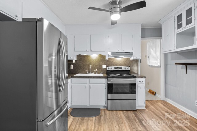 394 Efird St, Gastonia, NC 28054 - kitchen with a sink, dark countertops, a ceiling fan, under cabinet range hood, and appliances with stainless steel finishes