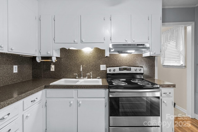 394 Efird St, Gastonia, NC 28054 - kitchen with dark countertops, a sink, stainless steel electric range oven, white cabinets, and under cabinet range hood