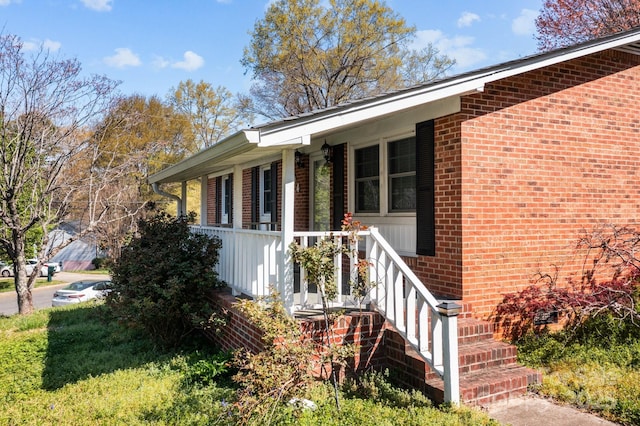 394 Efird St, Gastonia, NC 28054 - view of side of home featuring brick siding and a porch