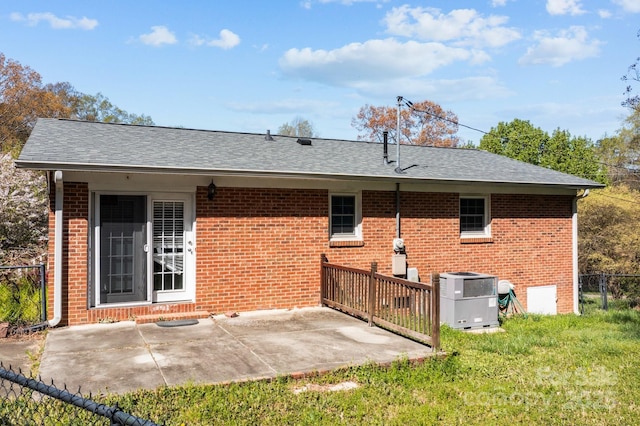 394 Efird St, Gastonia, NC 28054 - back of house with central AC unit, brick siding, fence, and a patio area