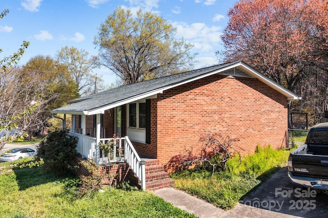 394 Efird St, Gastonia, NC 28054 - view of home's exterior with brick siding and a porch