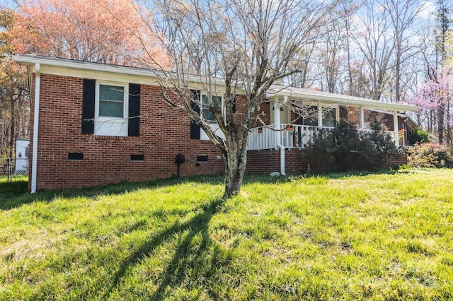 394 Efird St, Gastonia, NC 28054 - view of front of house featuring brick siding, a front lawn, and crawl space