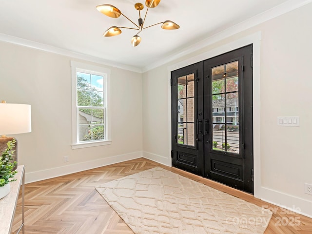 2909 Hanson Dr, Charlotte, NC 28207 - foyer entrance featuring crown molding, french doors, baseboards, and a notable chandelier