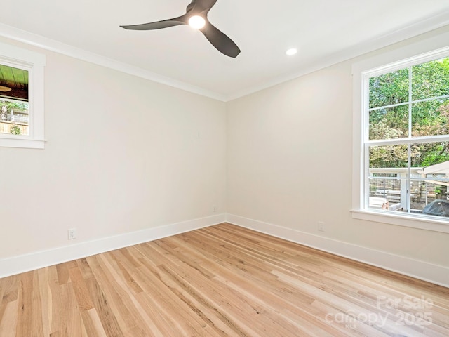 2909 Hanson Dr, Charlotte, NC 28207 - empty room with light wood finished floors, baseboards, crown molding, and a ceiling fan