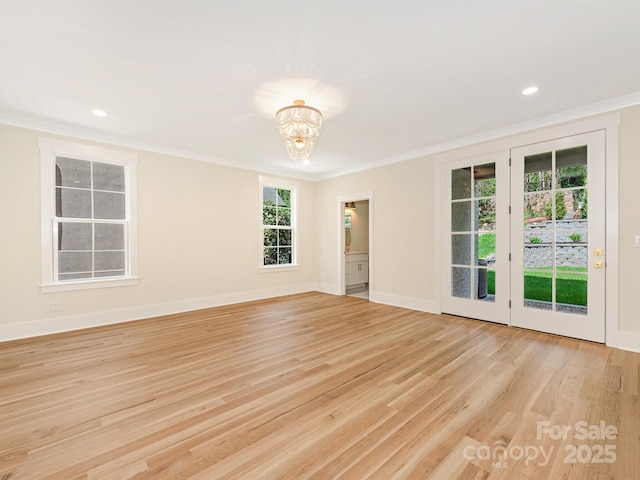 2909 Hanson Dr, Charlotte, NC 28207 - empty room with a notable chandelier, baseboards, recessed lighting, light wood-style flooring, and crown molding
