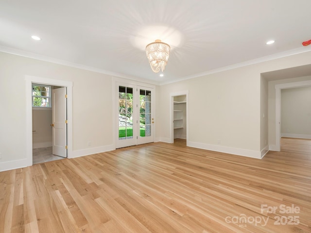 2909 Hanson Dr, Charlotte, NC 28207 - unfurnished room featuring ornamental molding, light wood-style floors, and a healthy amount of sunlight